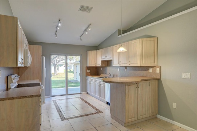 kitchen featuring visible vents, a sink, backsplash, light tile patterned floors, and white microwave