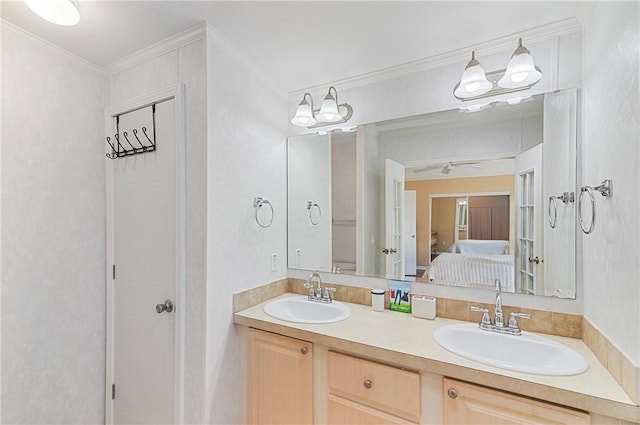 1218 Chipewa Dr, Sebastian, FL 32976 - bathroom with ensuite bathroom, double vanity, ornamental molding, and a ceiling fan