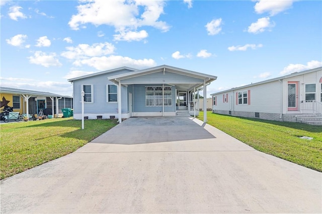 1218 Chipewa Dr, Sebastian, FL 32976 - manufactured / mobile home featuring driveway and a front yard