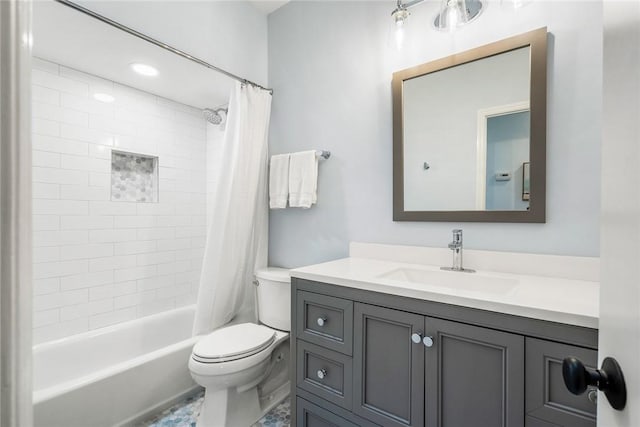 full bath featuring toilet, vanity, and shower / bath combination with curtain