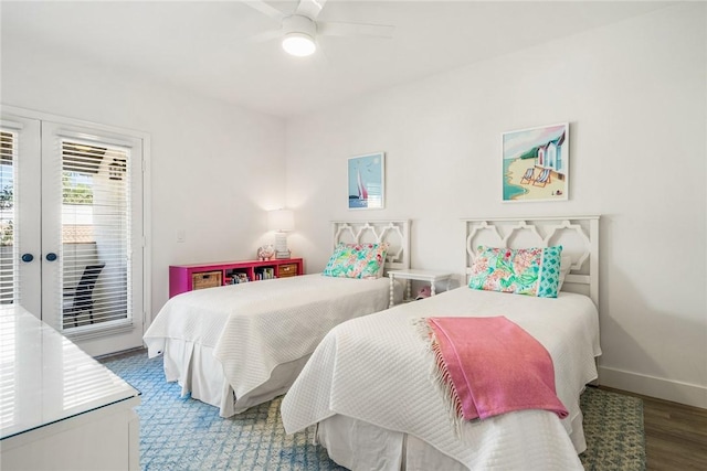 bedroom featuring wood finished floors, baseboards, ceiling fan, french doors, and access to outside