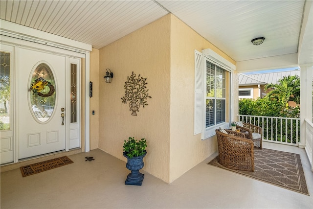 property entrance featuring covered porch