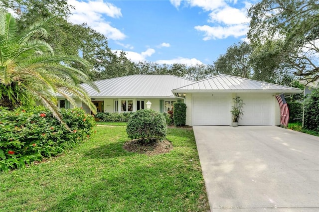 ranch-style home featuring a garage and a front yard