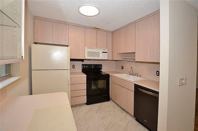 kitchen with light brown cabinets, a textured ceiling, black appliances, and sink