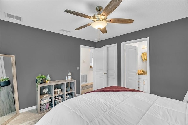 1360 18th Ave SW, Vero Beach, FL 32962 - bedroom featuring connected bathroom, baseboards, and ceiling fan