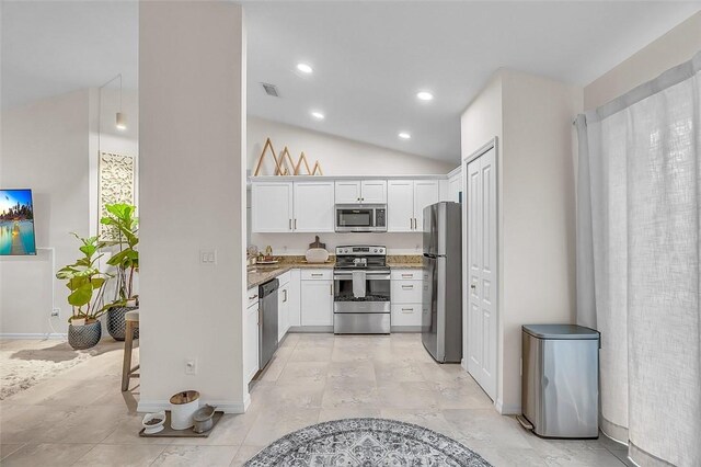 1360 18th Ave SW, Vero Beach, FL 32962 - kitchen with appliances with stainless steel finishes, white cabinetry, vaulted ceiling, recessed lighting, and baseboards
