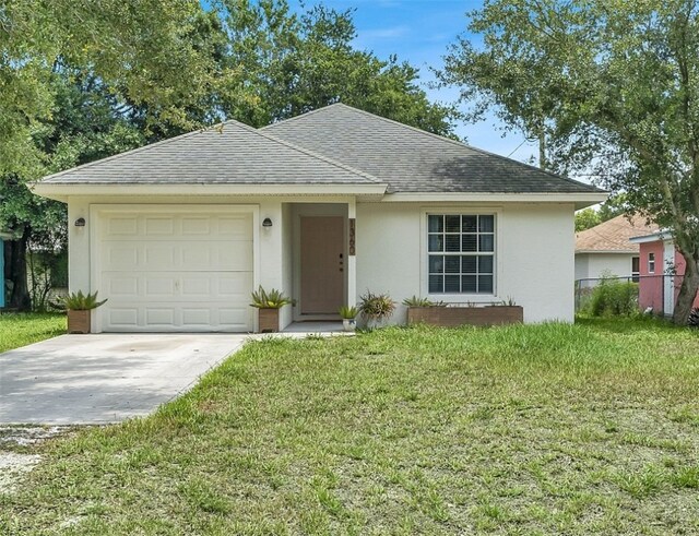 1360 18th Ave SW, Vero Beach, FL 32962 - single story home with stucco siding, driveway, a garage, a shingled roof, and a front yard
