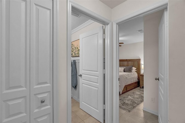 1360 18th Ave SW, Vero Beach, FL 32962 - hallway with light tile patterned floors and baseboards