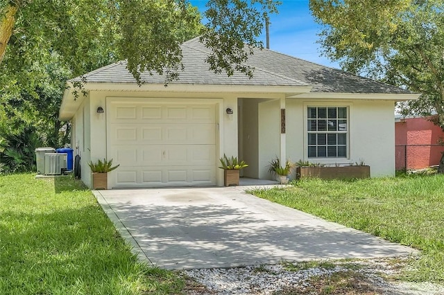 1360 18th Ave SW, Vero Beach, FL 32962 - view of front of home with driveway, stucco siding, a front lawn, an attached garage, and roof with shingles