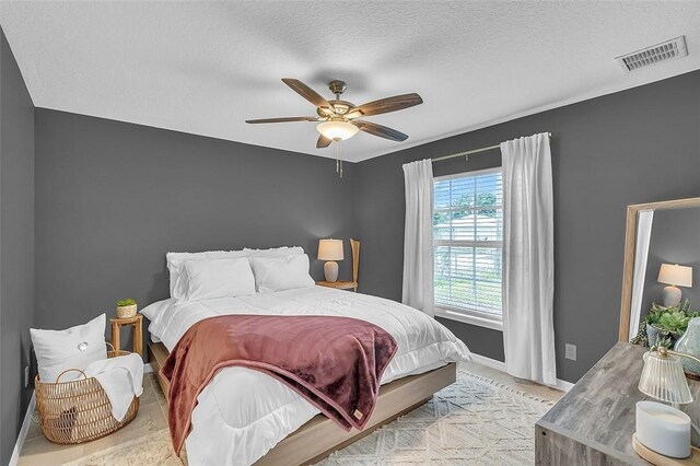 1360 18th Ave SW, Vero Beach, FL 32962 - bedroom featuring baseboards, ceiling fan, and a textured ceiling