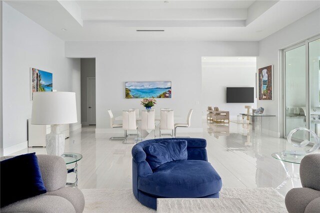 living room with a tray ceiling