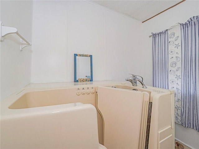 bathroom featuring a textured ceiling