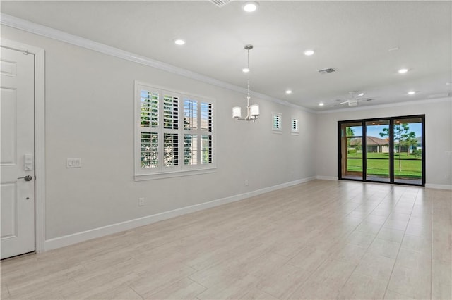 spare room with recessed lighting, baseboards, and crown molding