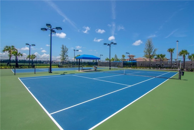 view of sport court with community basketball court and fence