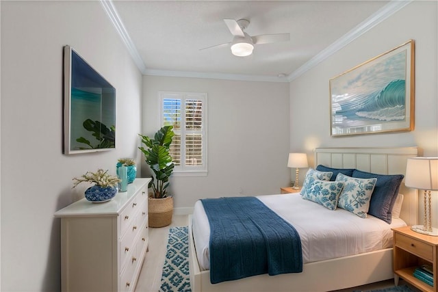 bedroom featuring a ceiling fan, baseboards, and ornamental molding