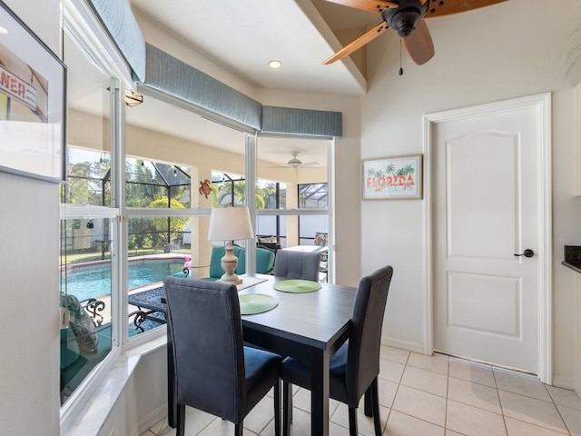 dining space featuring ceiling fan and light tile patterned floors