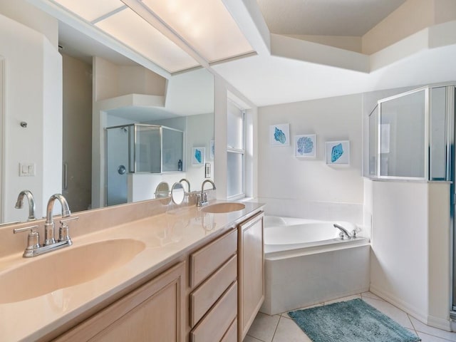 bathroom featuring shower with separate bathtub, tile patterned floors, and vanity