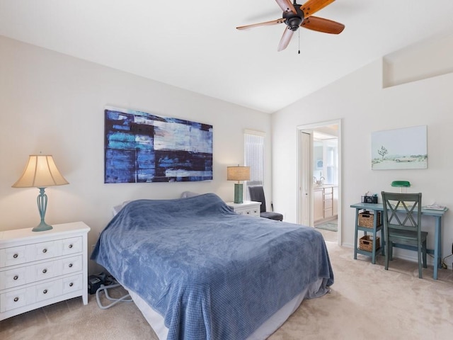 carpeted bedroom featuring lofted ceiling, ceiling fan, and connected bathroom