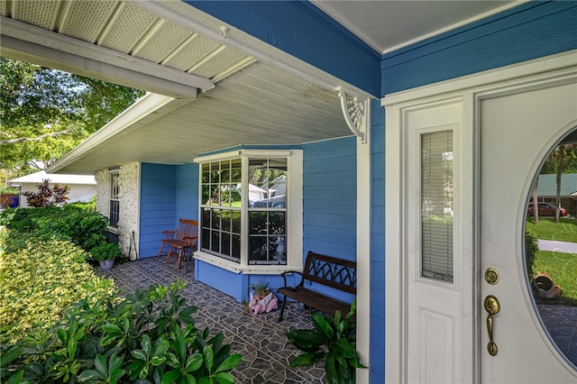 entrance to property featuring covered porch