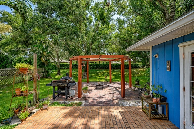 view of patio / terrace featuring an outdoor fire pit and a pergola