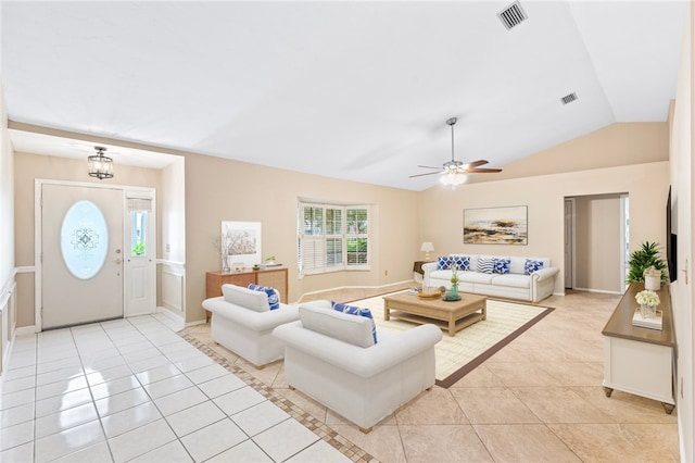 tiled living room featuring lofted ceiling and ceiling fan