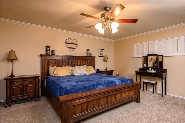 carpeted bedroom featuring ceiling fan and crown molding