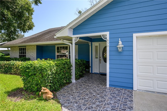 entrance to property featuring a garage