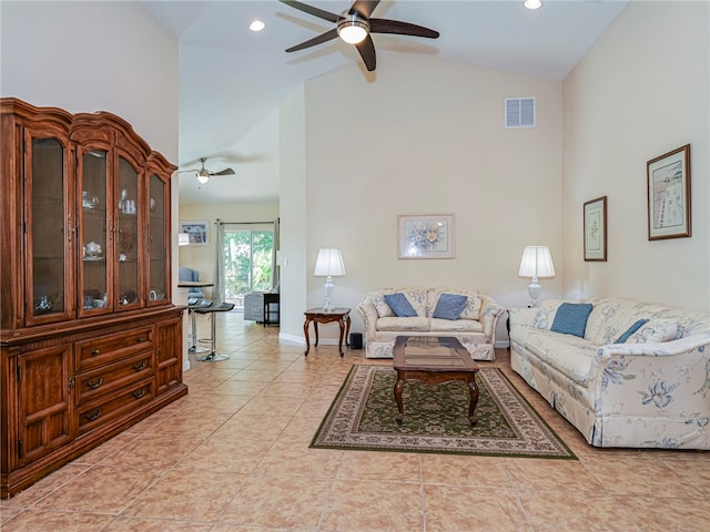 tiled living room featuring ceiling fan and high vaulted ceiling