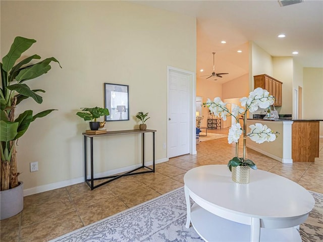 545 Valencia Cir SW, Vero Beach, FL 32968 - foyer entrance featuring high vaulted ceiling, baseboards, light tile patterned floors, recessed lighting, and a ceiling fan