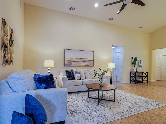 545 Valencia Cir SW, Vero Beach, FL 32968 - living room with ceiling fan, vaulted ceiling, tile patterned floors, baseboards, and recessed lighting