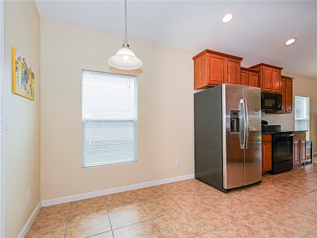 kitchen with pendant lighting, light tile patterned floors, and black appliances