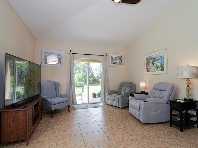 living area with high vaulted ceiling, light tile patterned floors, and ceiling fan