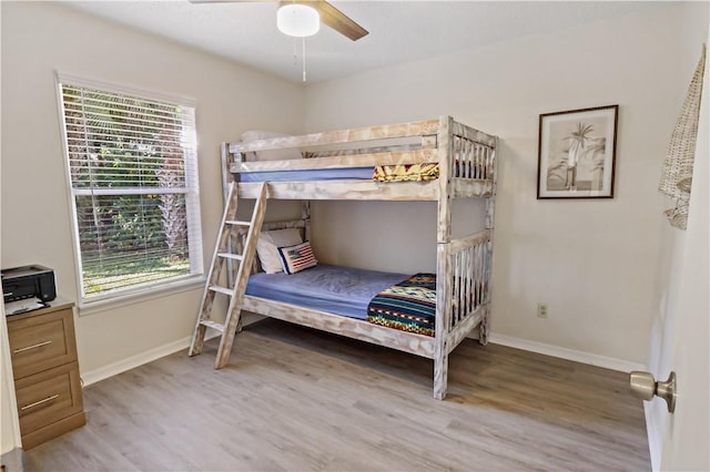 bedroom with hardwood / wood-style flooring and ceiling fan