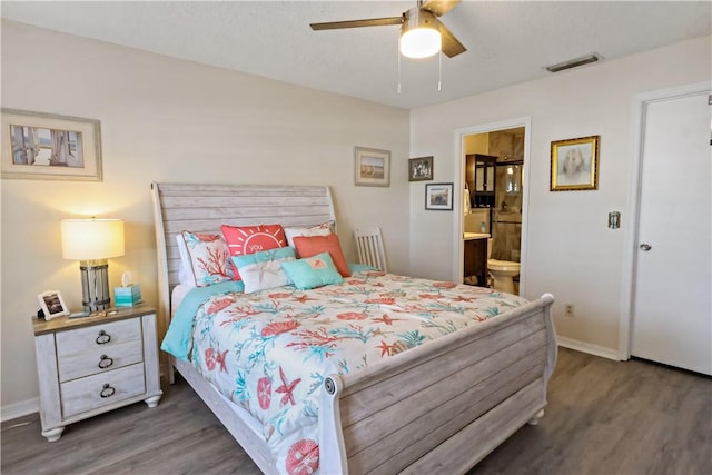 bedroom featuring connected bathroom, ceiling fan, and dark wood-type flooring