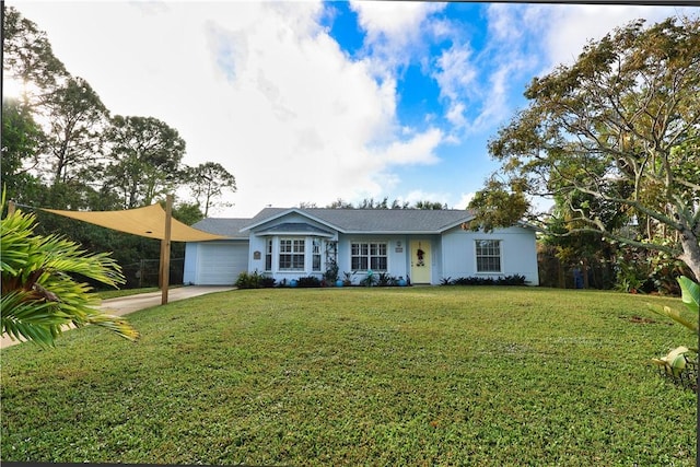 single story home with a front lawn and a garage