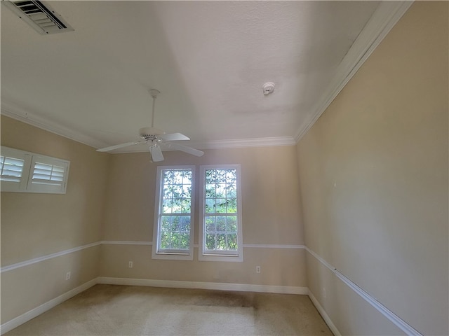 spare room with carpet flooring, ceiling fan, and ornamental molding