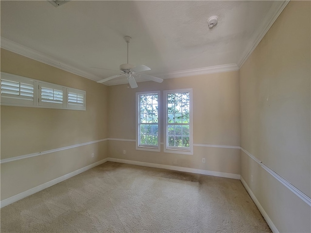 unfurnished room with light carpet, crown molding, and ceiling fan