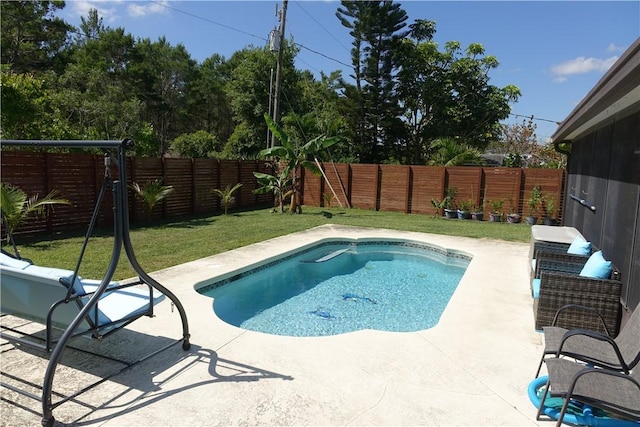 view of pool with a fenced backyard, a fenced in pool, a yard, and a patio area
