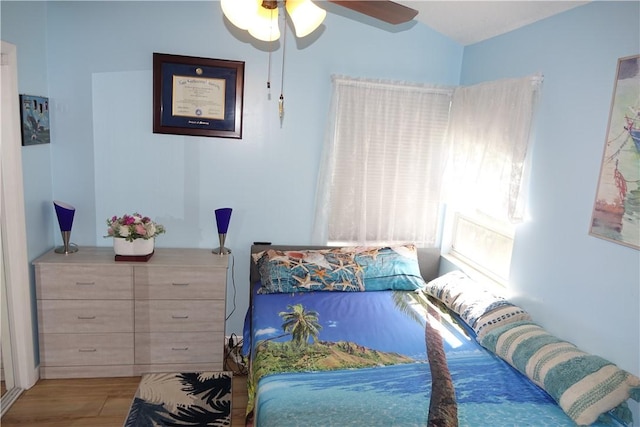 bedroom featuring ceiling fan and wood finished floors