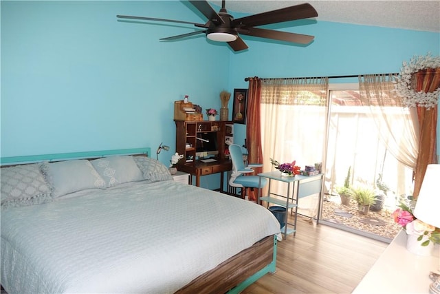 bedroom with light wood-style floors, ceiling fan, and vaulted ceiling