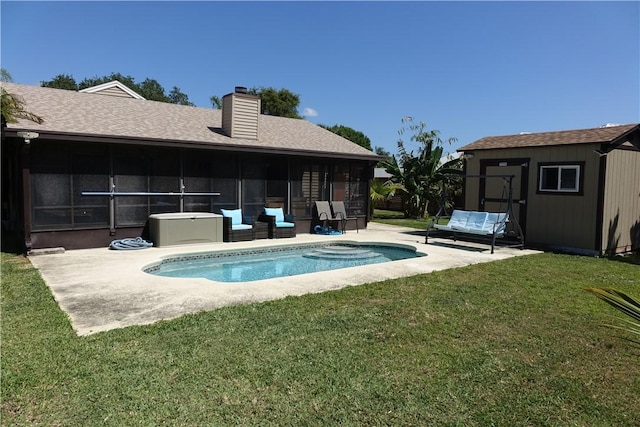 pool with an outdoor structure, a patio, a yard, a sunroom, and a storage shed