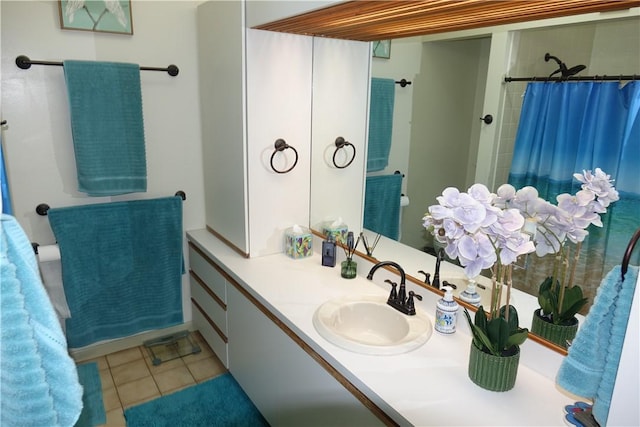full bathroom with curtained shower, tile patterned flooring, and vanity