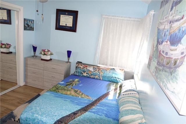 bedroom with wood finished floors