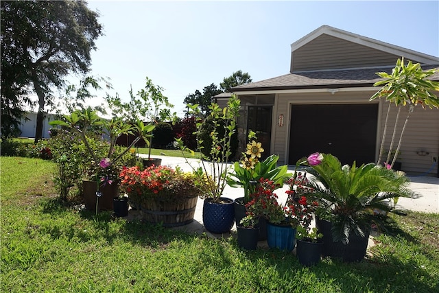 view of yard featuring an attached garage