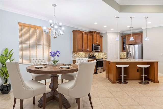 tiled dining room with a chandelier and ornamental molding