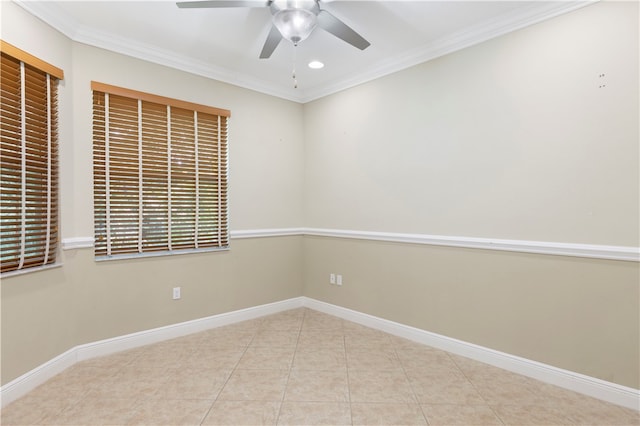 spare room with ceiling fan, crown molding, and light tile patterned floors