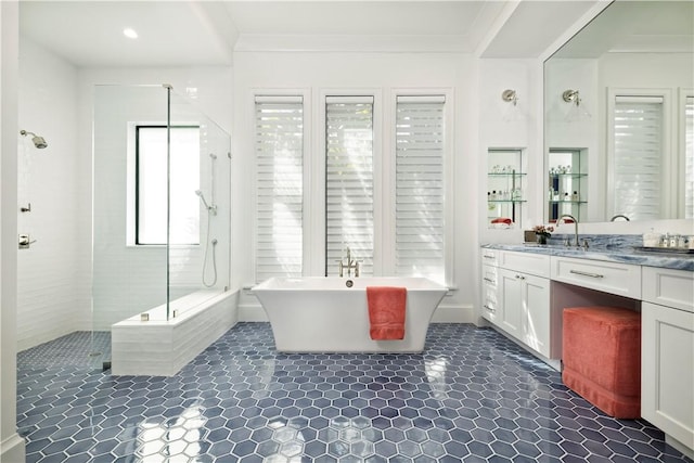 bathroom featuring plus walk in shower and vanity