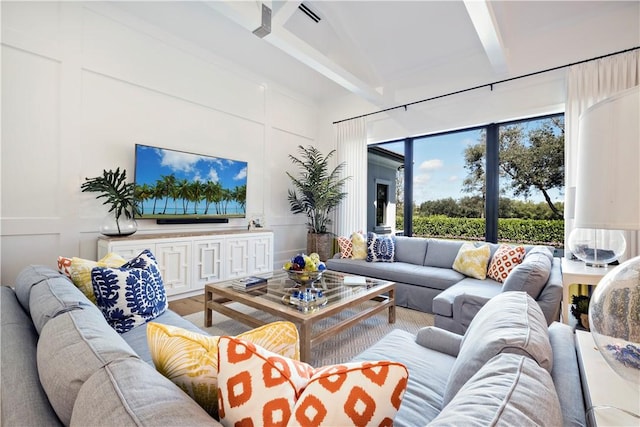 living room featuring beam ceiling