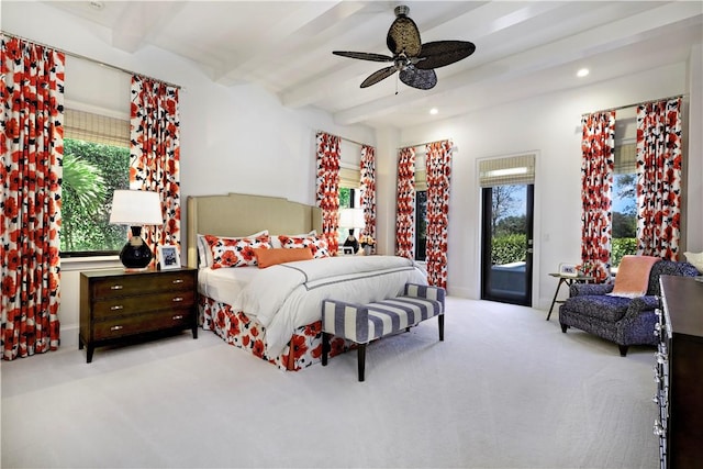 bedroom featuring beamed ceiling, ceiling fan, access to exterior, and light carpet