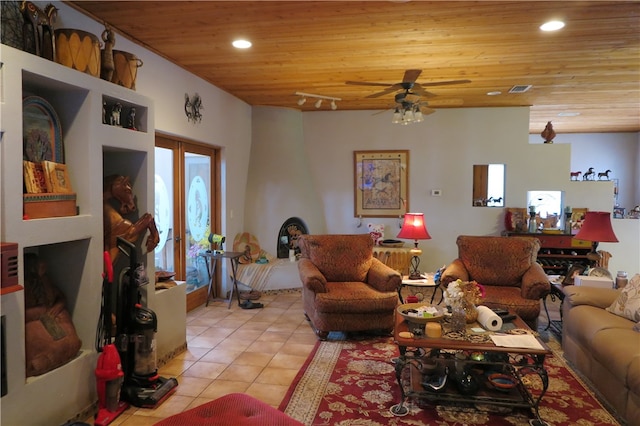 tiled living room with ceiling fan and wood ceiling